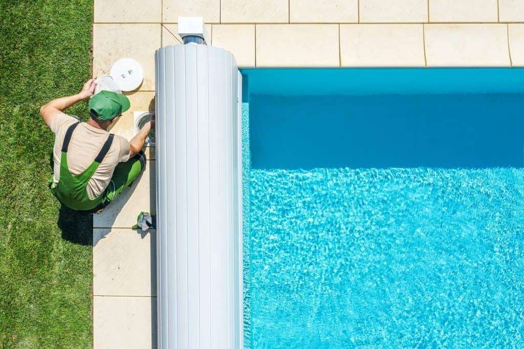 outdoor swimming pool skimmer filter cleaning aerial view