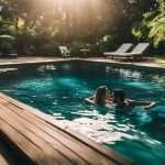 Two people swimming in a pool.