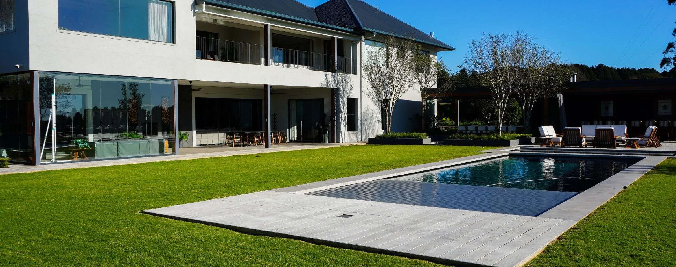 A house with a swimming pool in the backyard.