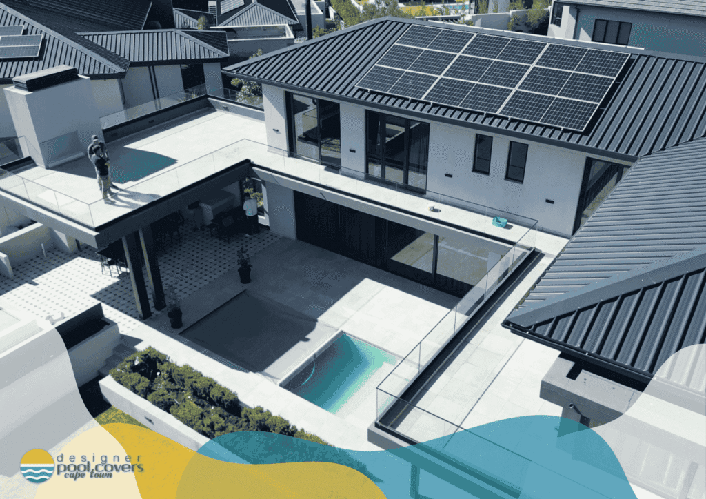 A modern house with solar panels on the roof, multiple balconies, and a small covered pool in the courtyard. The "Designer Pool Covers" logo is in the bottom left corner.